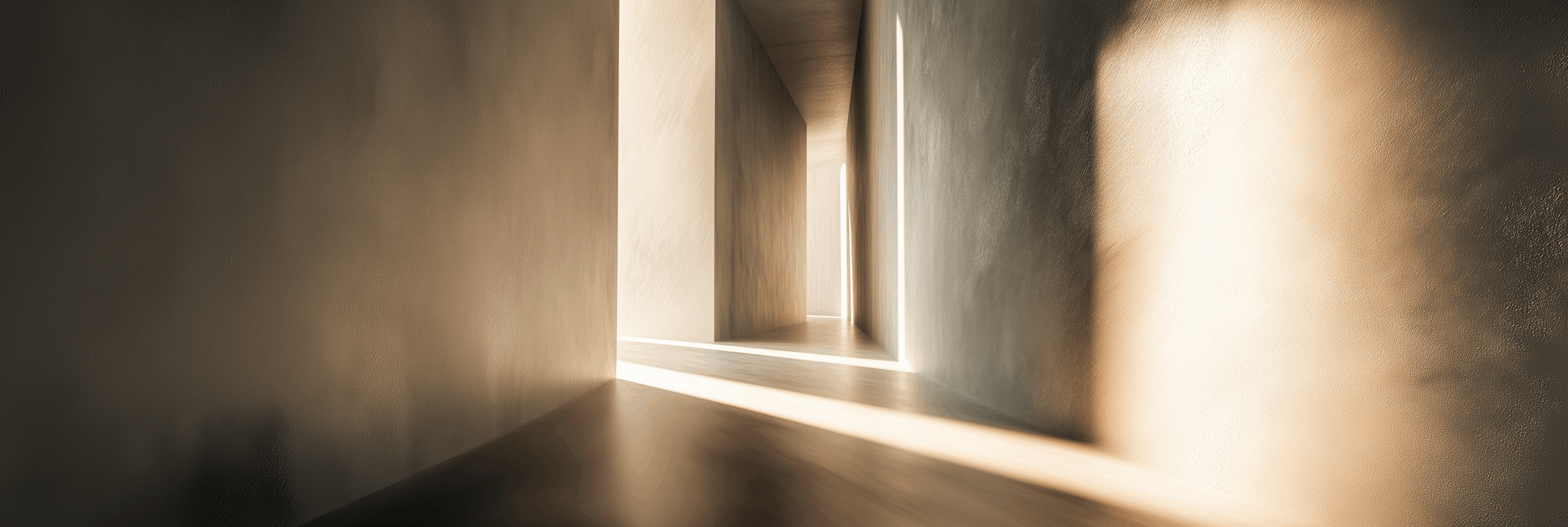 Sunlight casting soft, elongated shadows through a minimalist architectural corridor with textured walls and warm neutral tones, creating a calm, immersive atmosphere.